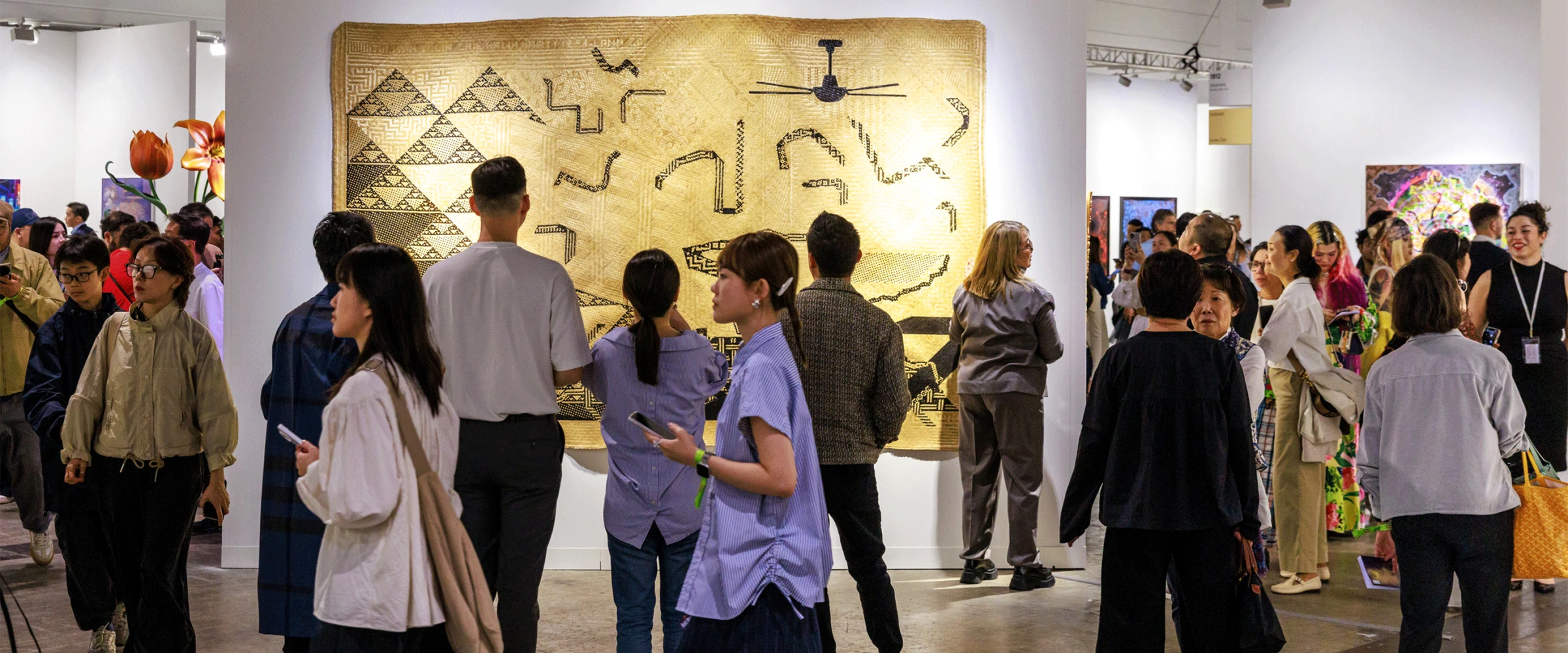 Visitors moving through crowded aisles at Art Basel Hong Kong 2026 inside the convention center