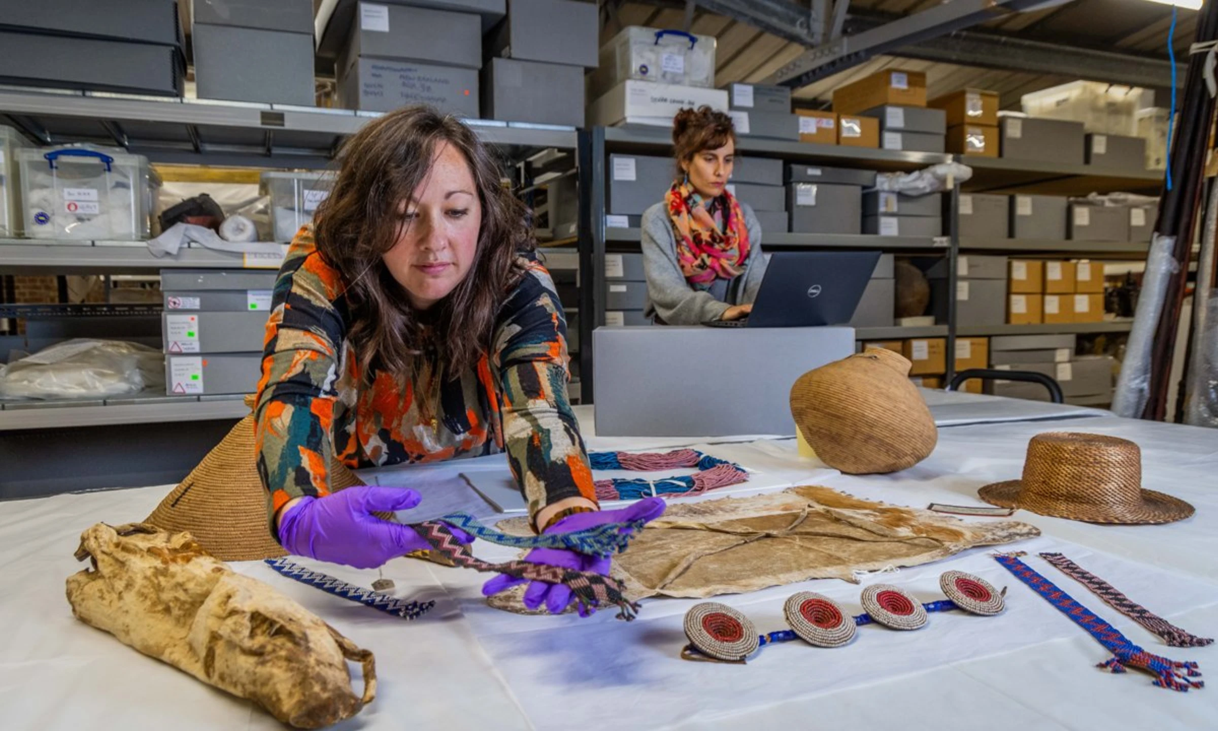 Display case of historical artefacts tied to Botswana repatriation project.