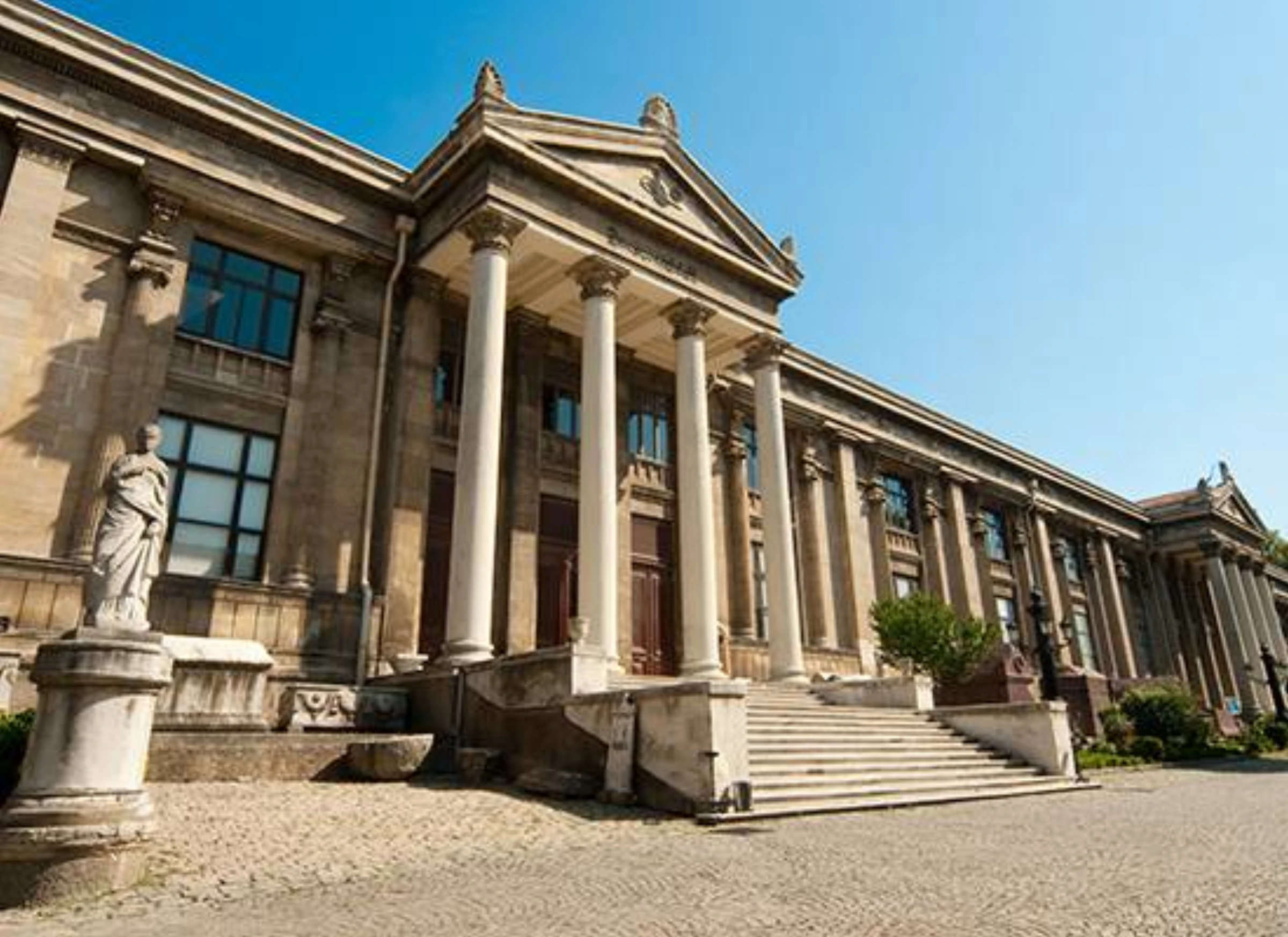 Interior view of Istanbul Archaeological Museums with carved stone artifacts and display cases.