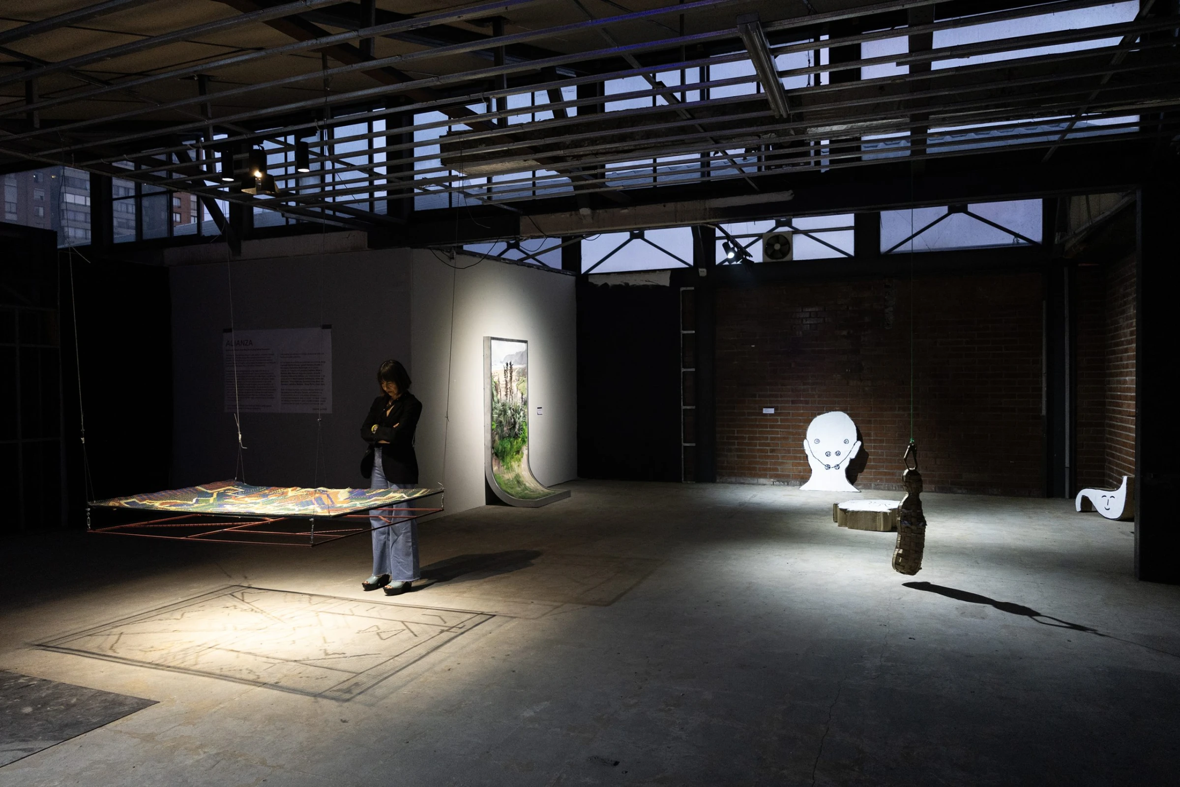 Contemporary installation inside Ch.ACO fair space with visitors moving through a large sculptural setup.