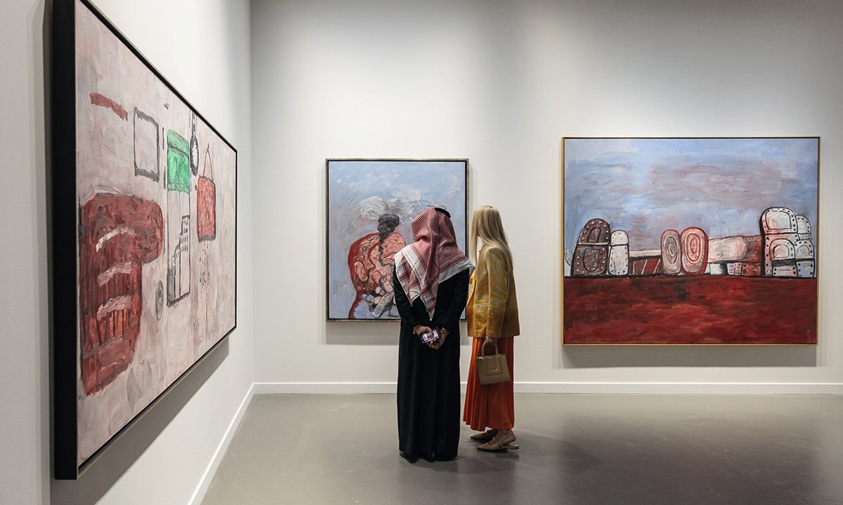 Details of a framed artwork and gallery wall.