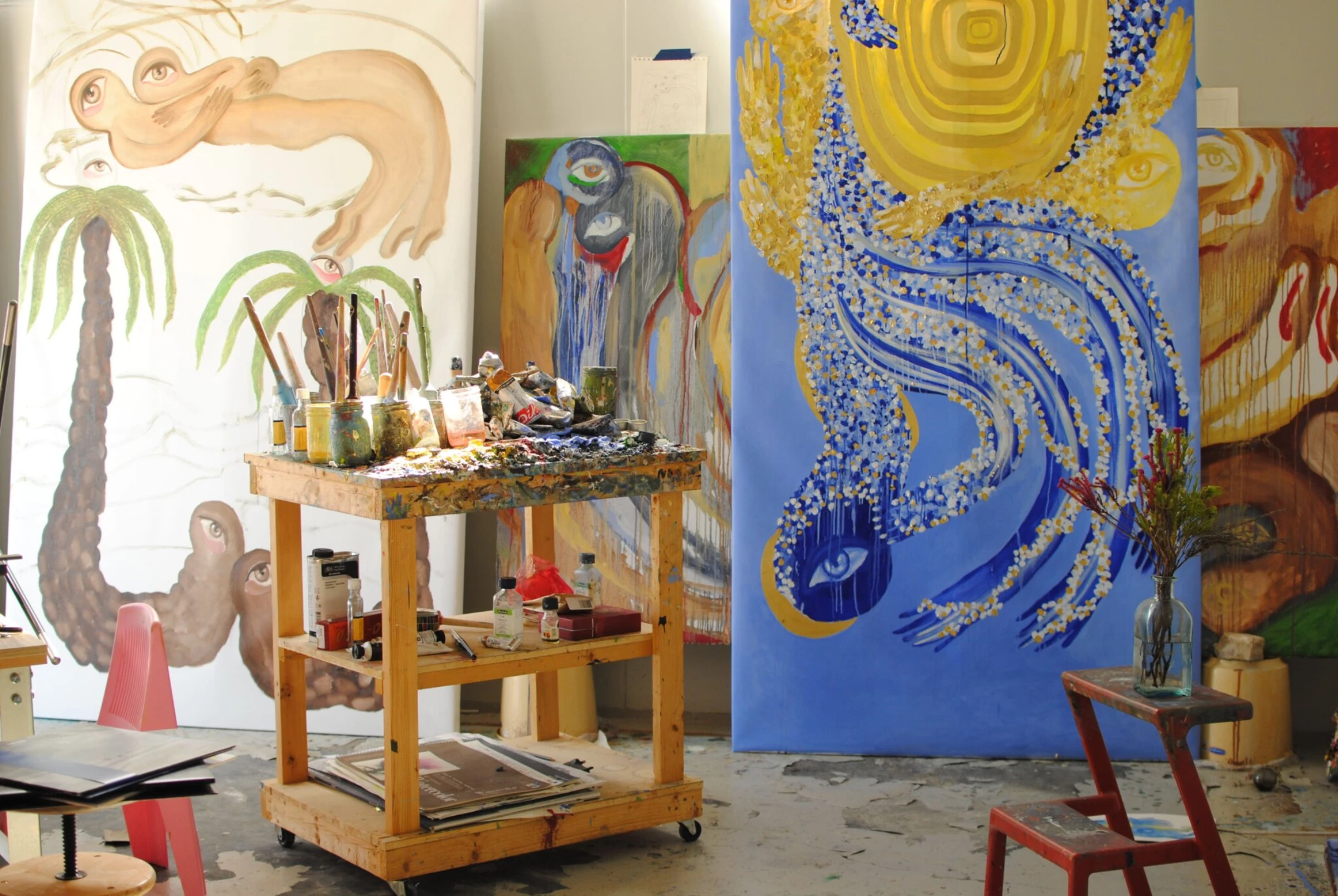 Visitors and booths at an international art fair in Dubai.