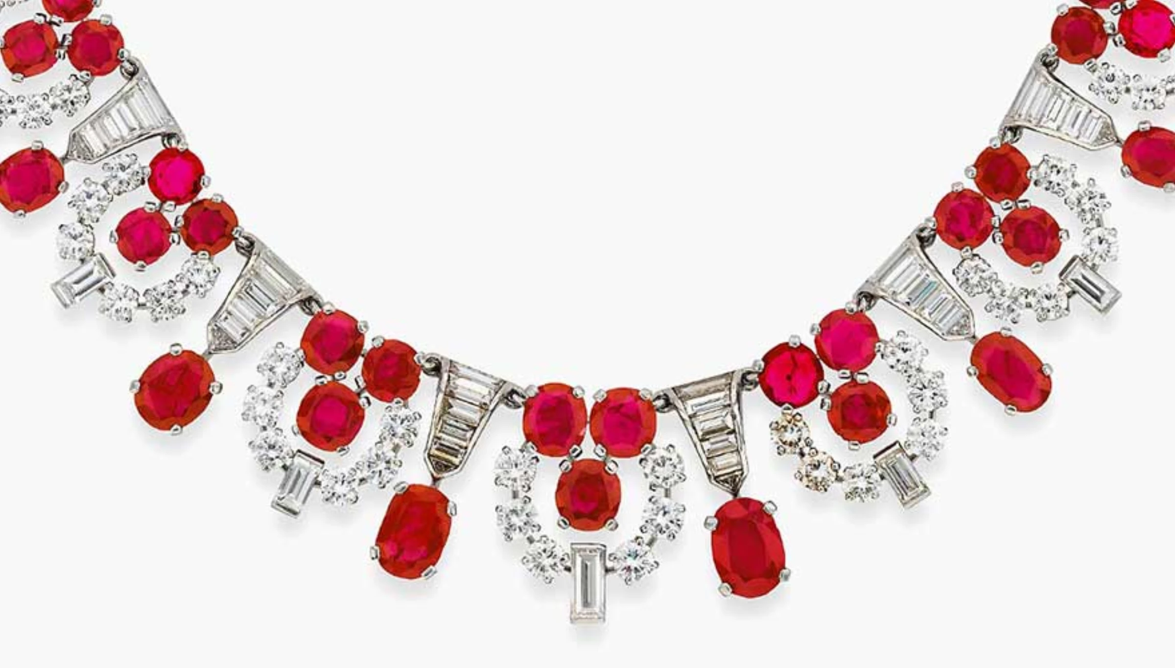 Display of high-jewelry pieces in a private sales presentation setting.