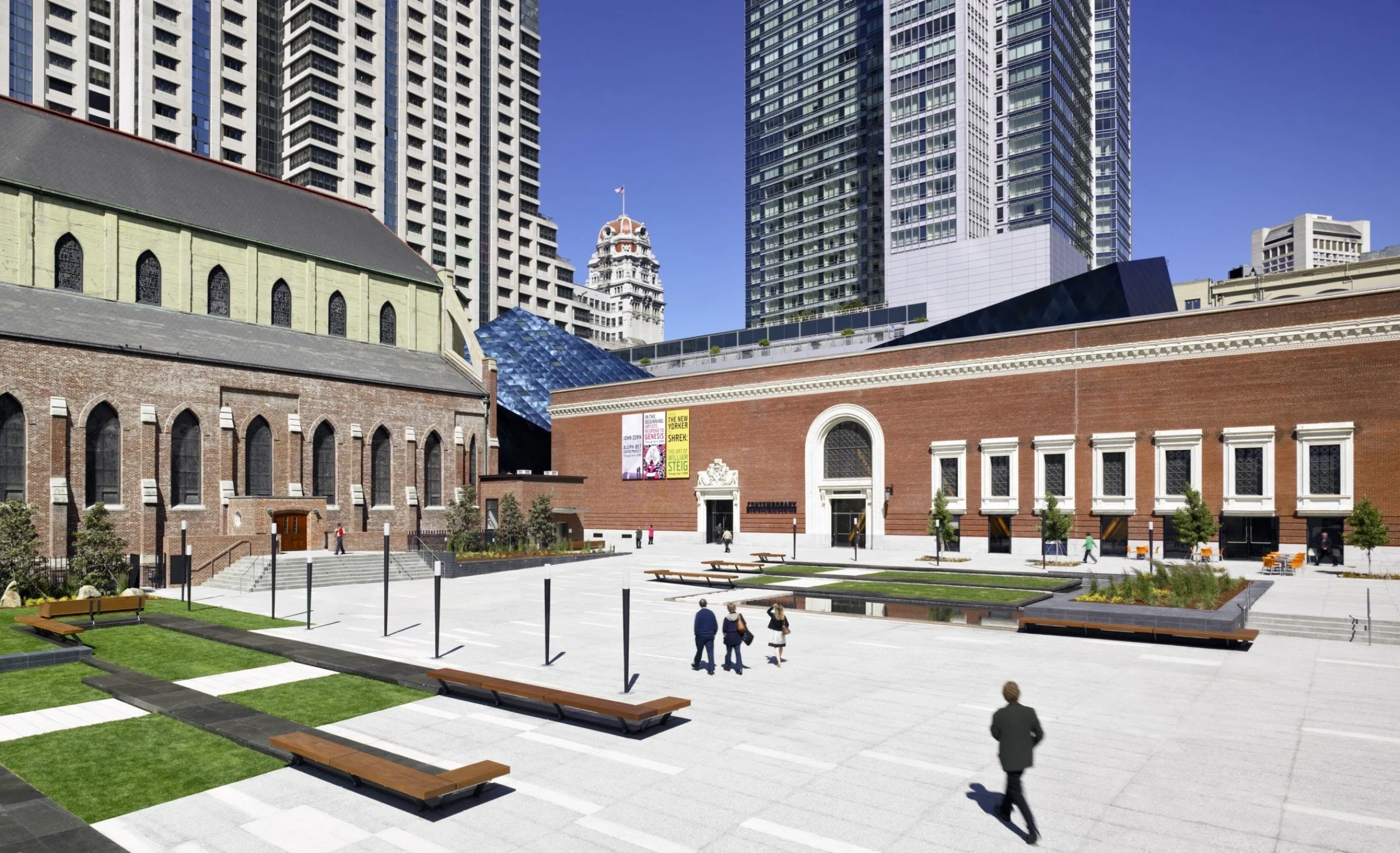 Exterior view of the Contemporary Jewish Museum in San Francisco, showing Daniel Libeskind’s blue steel-clad addition attached to the historic brick substation.
