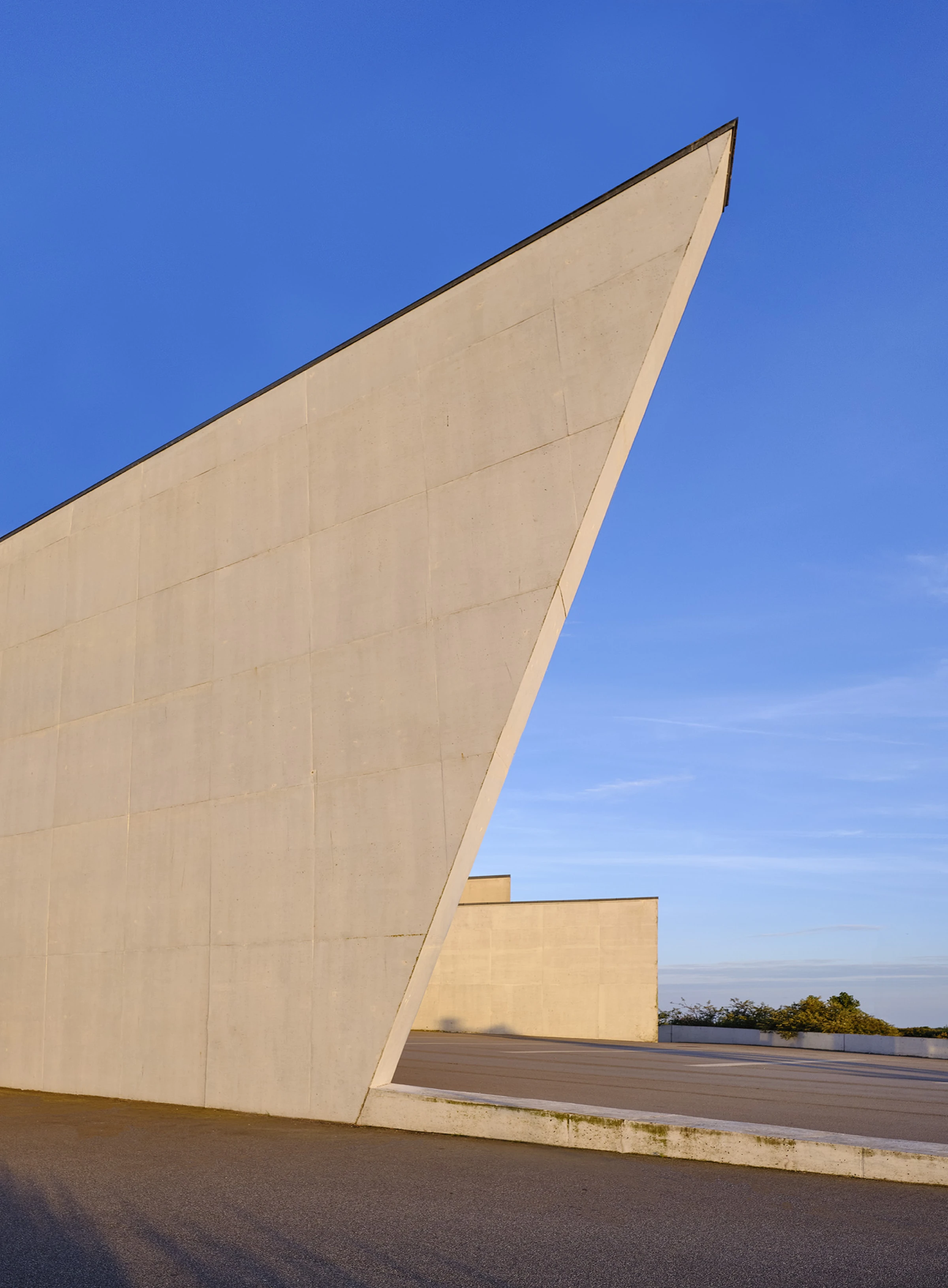 View of ARKEN Museum of Contemporary Art in Denmark, a geometric museum building near the coast.