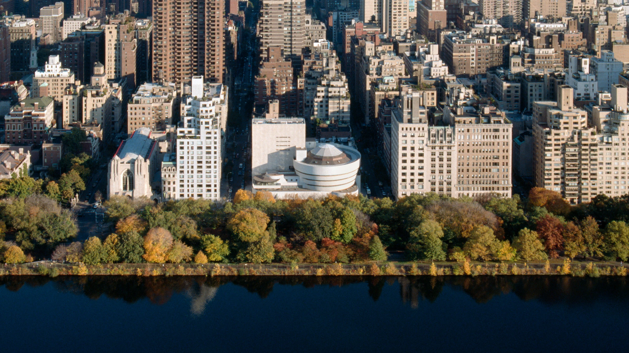 The Solomon R. Guggenheim Museum building in New York, Frank Lloyd Wright's spiral architecture visible against the sky