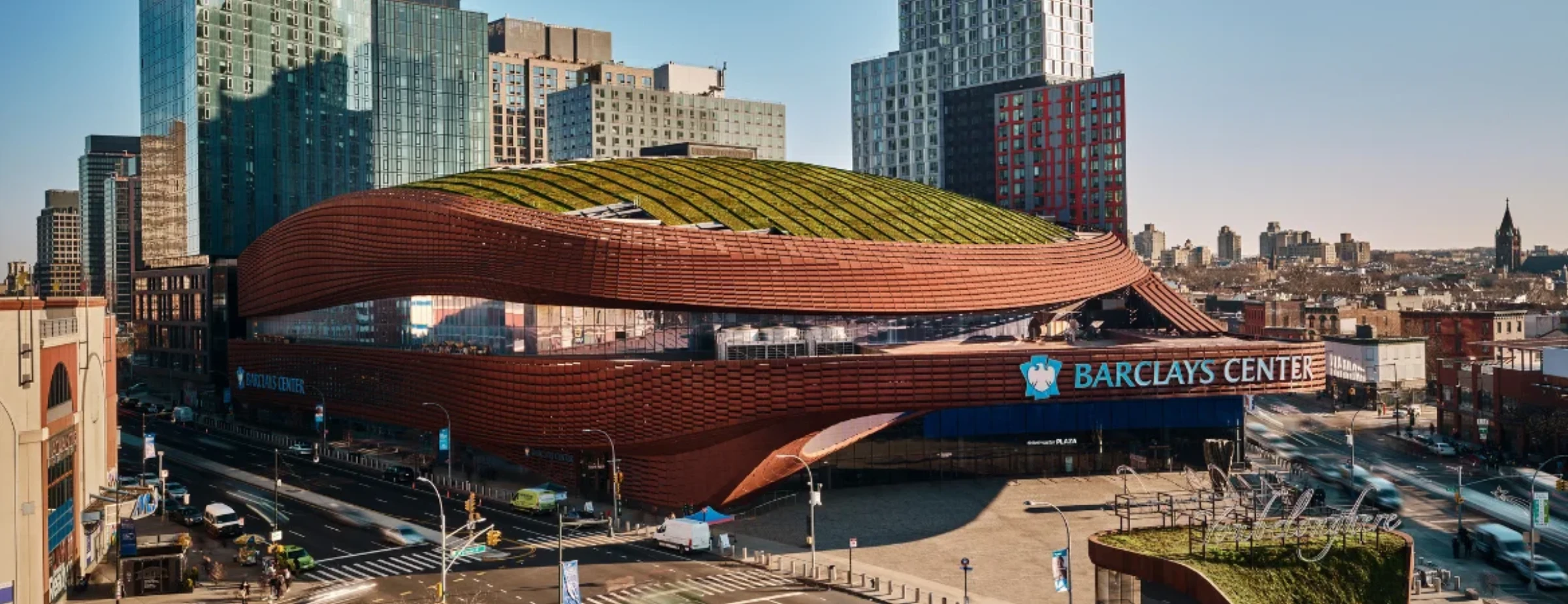 Exterior of Barclays Center showing large-scale architecture associated with public-facing art and media installations.