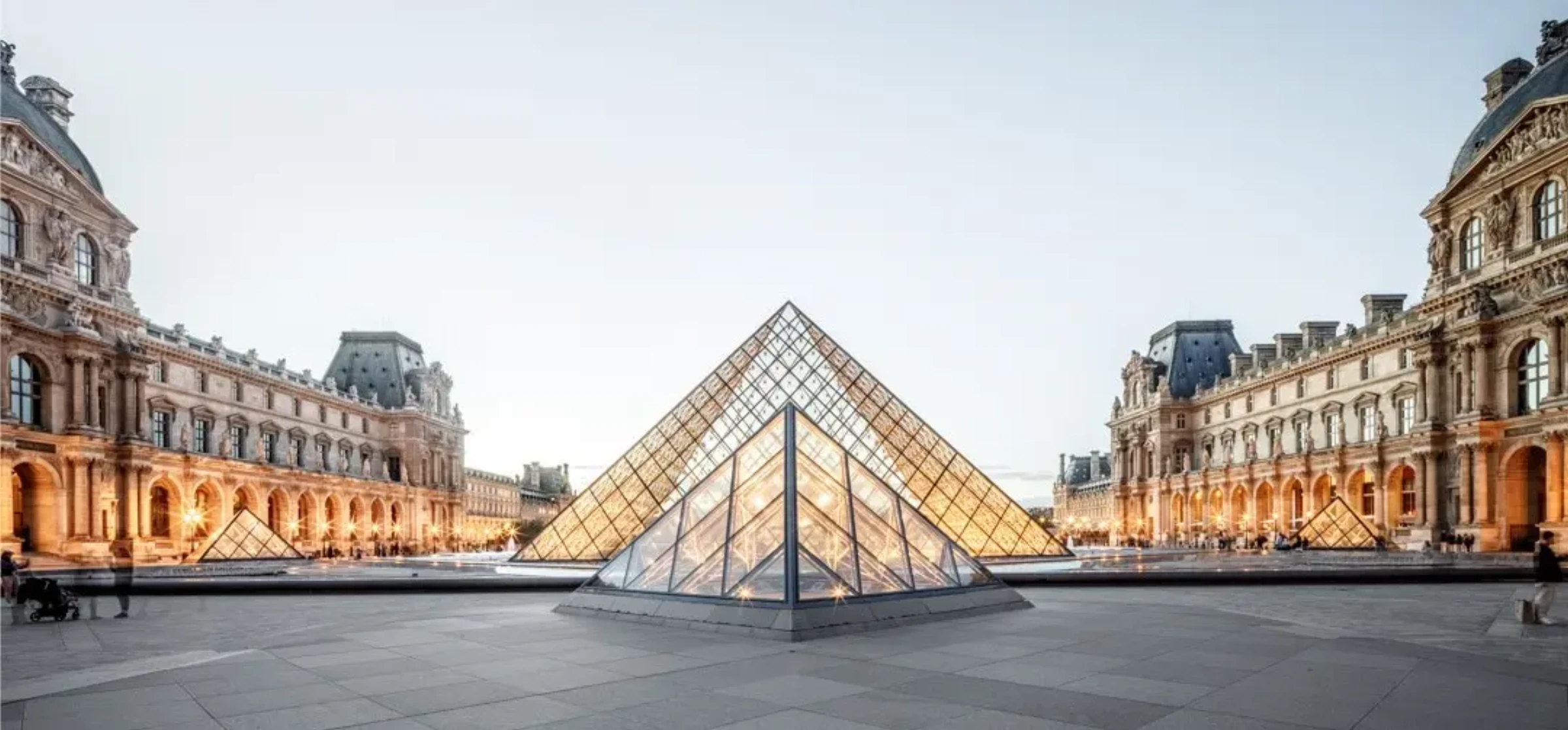 The Louvre pyramid and palace complex, representing a museum undergoing major renovation planning