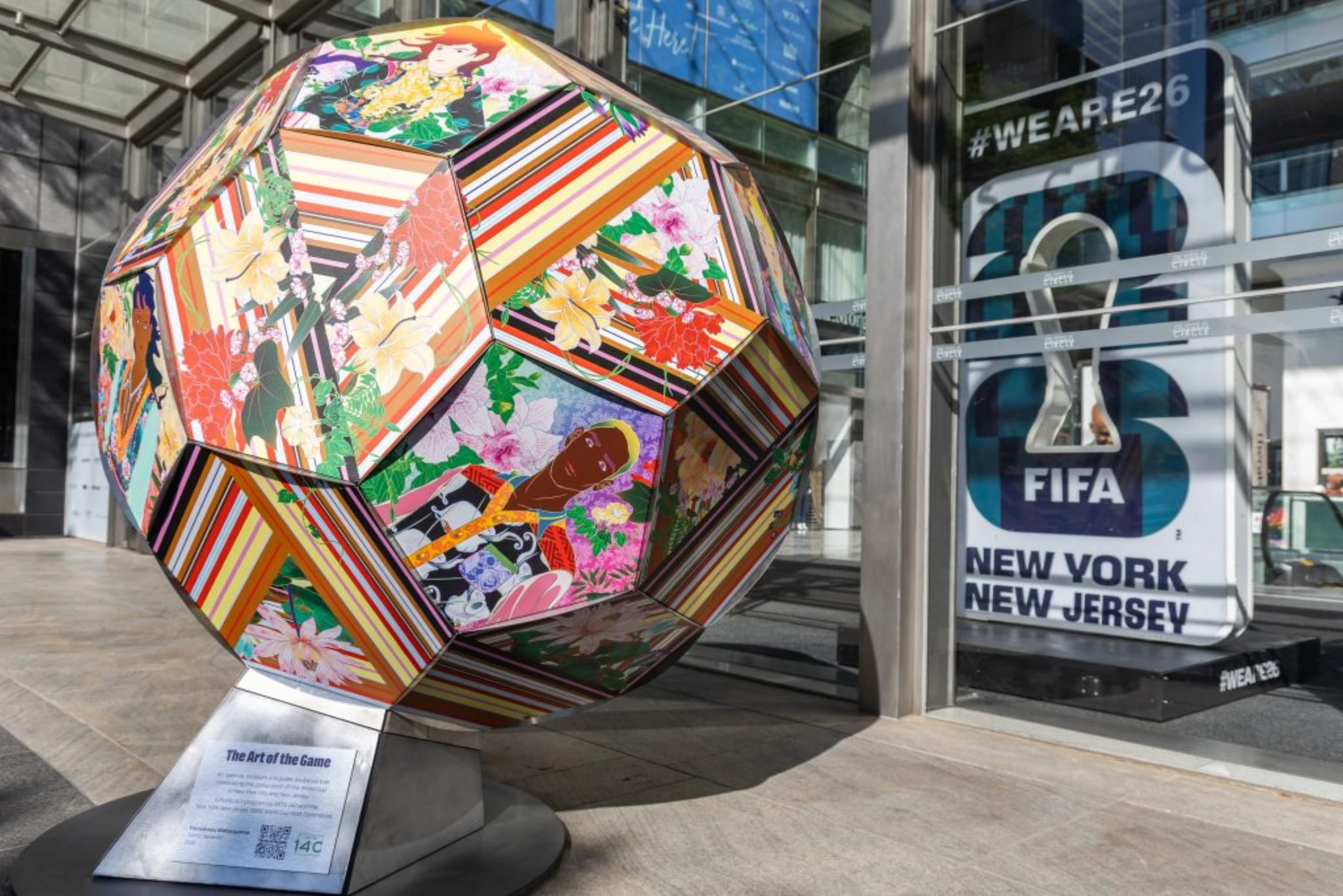Multiple artist-designed soccer ball sculptures installed outdoors for The Art of the Game project
