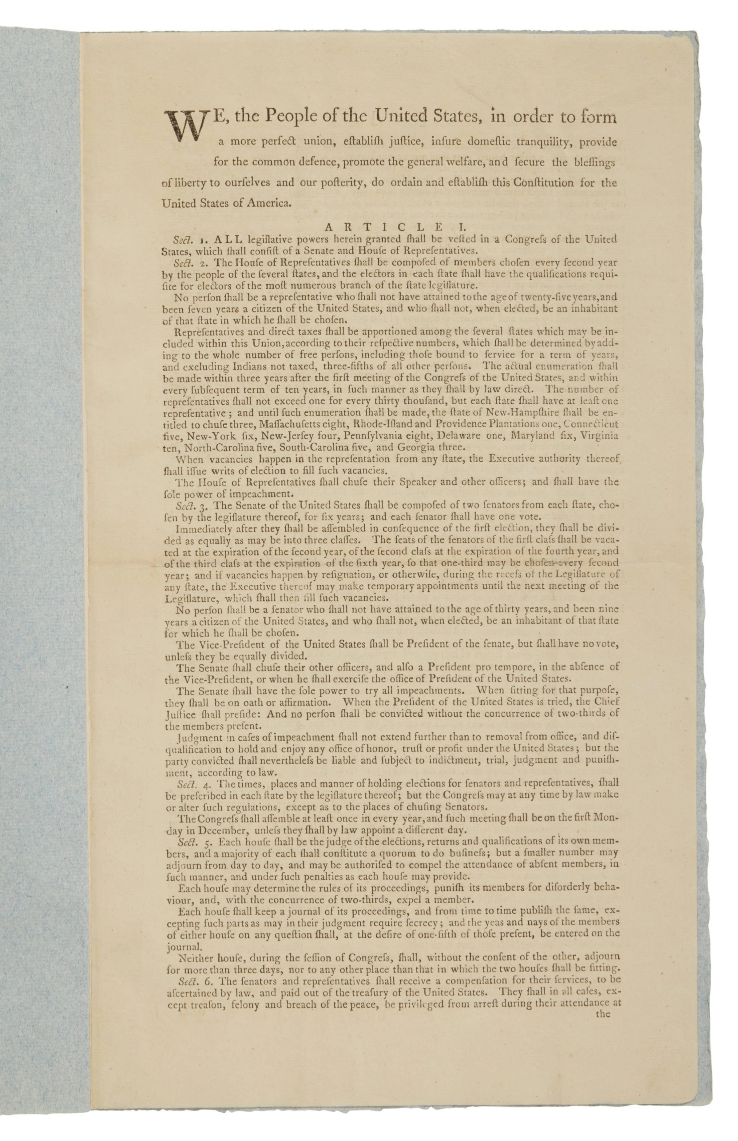 A first printing of the United States Constitution displayed open in a museum case