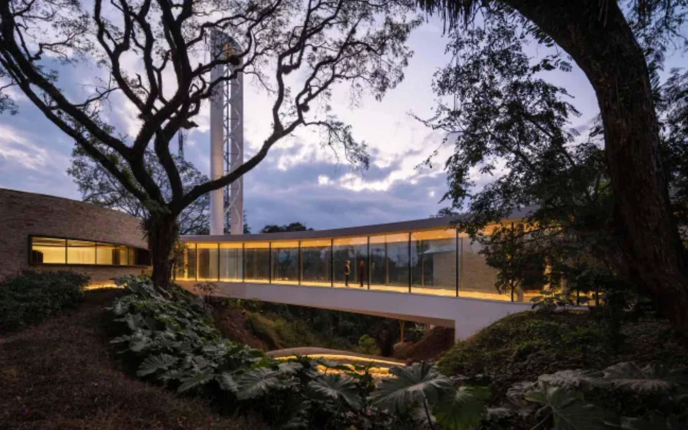 The Lola Mora Cultural Center in San Salvador de Jujuy, Argentina, a circular building nestled in the Yungas forest with wide terraces overlooking the city