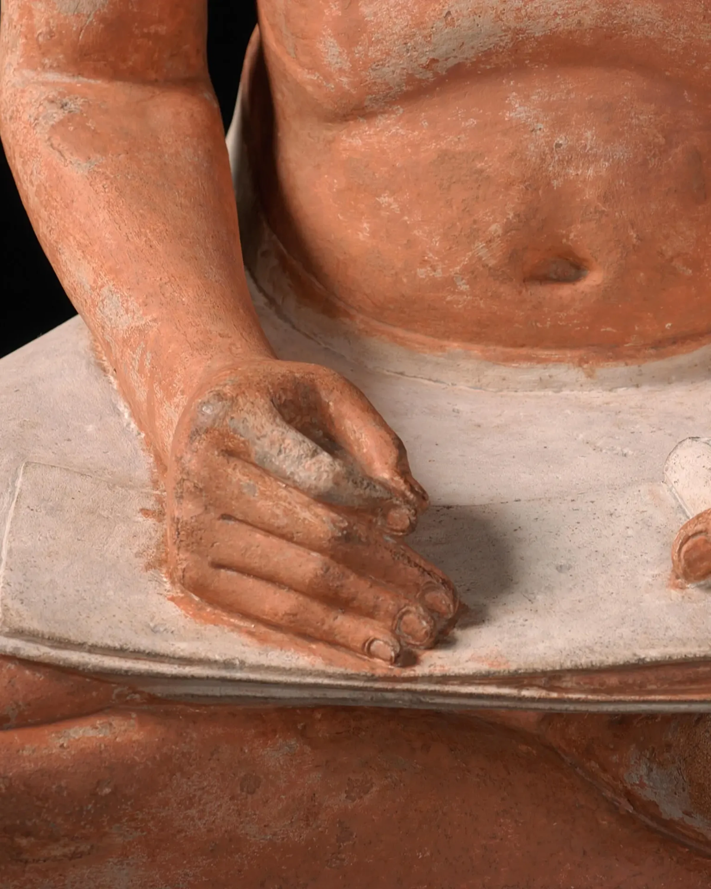 Detail view of an ancient Egyptian sculpture at the Louvre Museum.