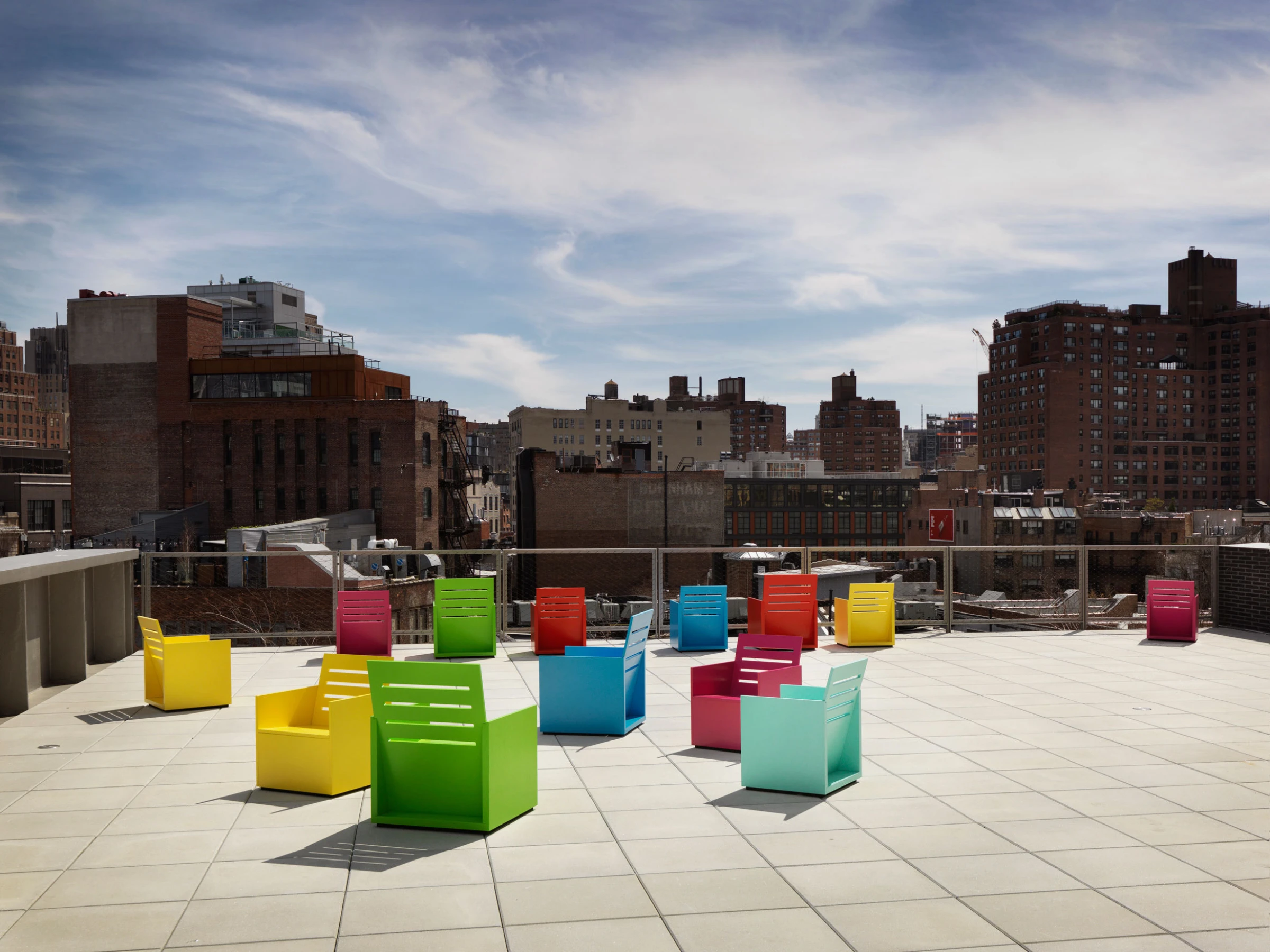 Installation view of Mary Heilmann's exhibition at the Whitney Museum of American Art, showing her vivid abstract paintings on gallery walls
