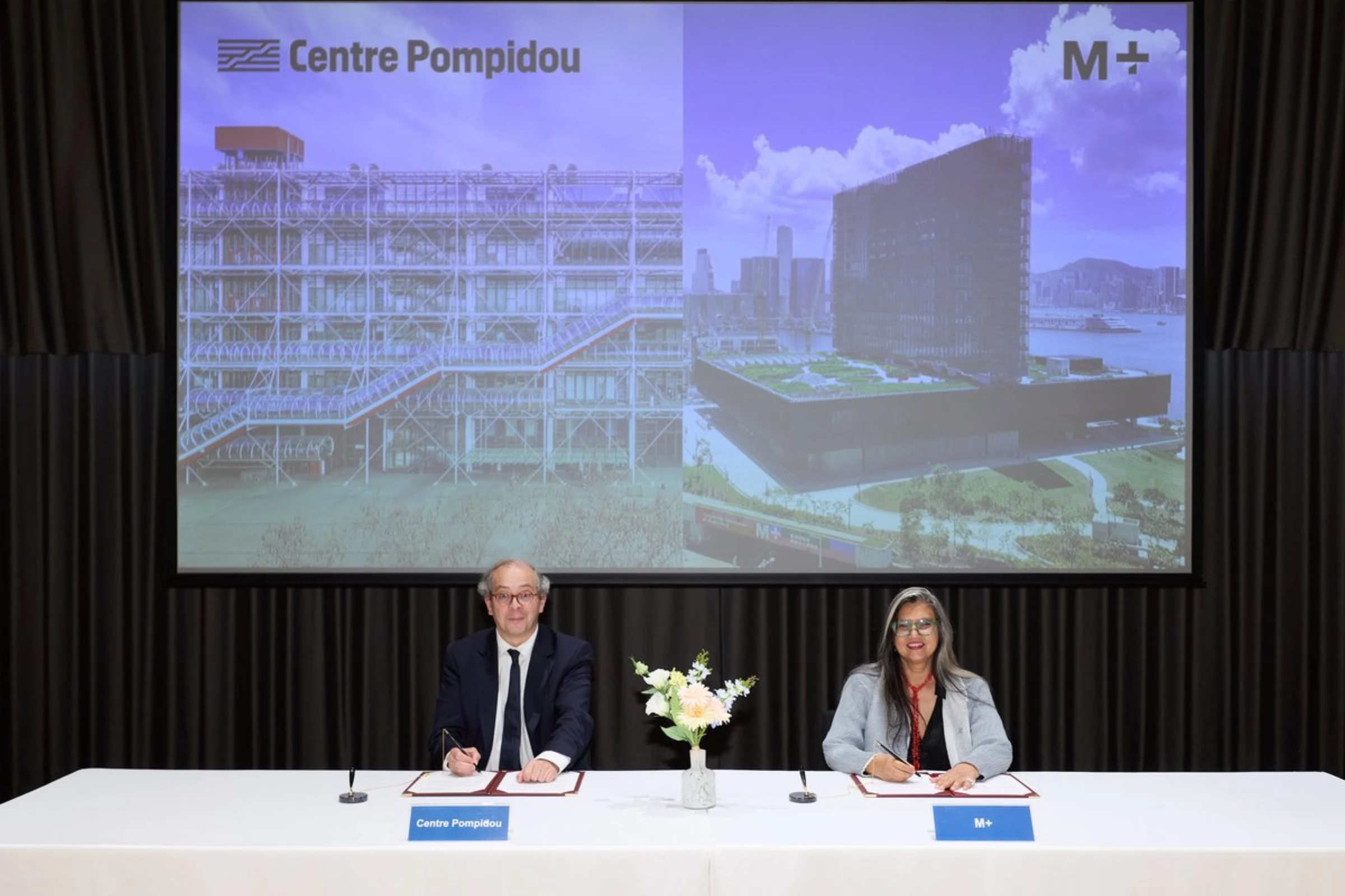 M+ director Suhanya Raffel and Centre Pompidou president Laurent Le Bon at the signing ceremony in Hong Kong