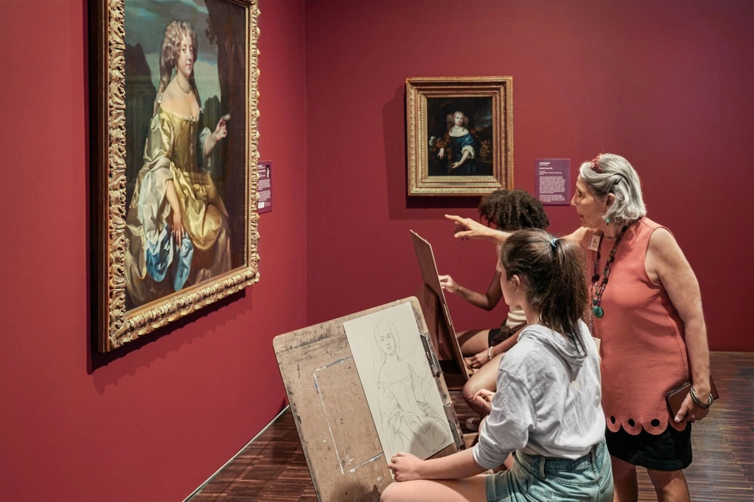 Conservators examine a modern abstract painting at a partner museum participating in the National Gallery’s lending initiative.