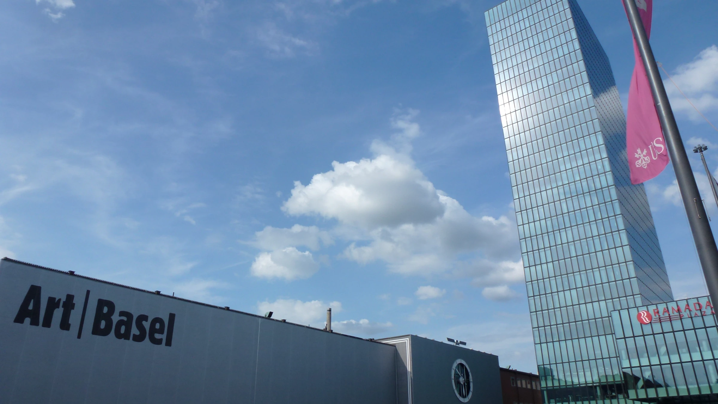 Visitors gathered in a contemporary fair-like exhibition hall