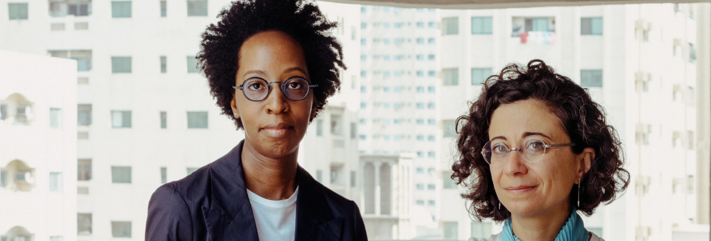 Portrait image of Sharjah Biennial 17 curators Angela Harutyunyan and Paula Nascimento.