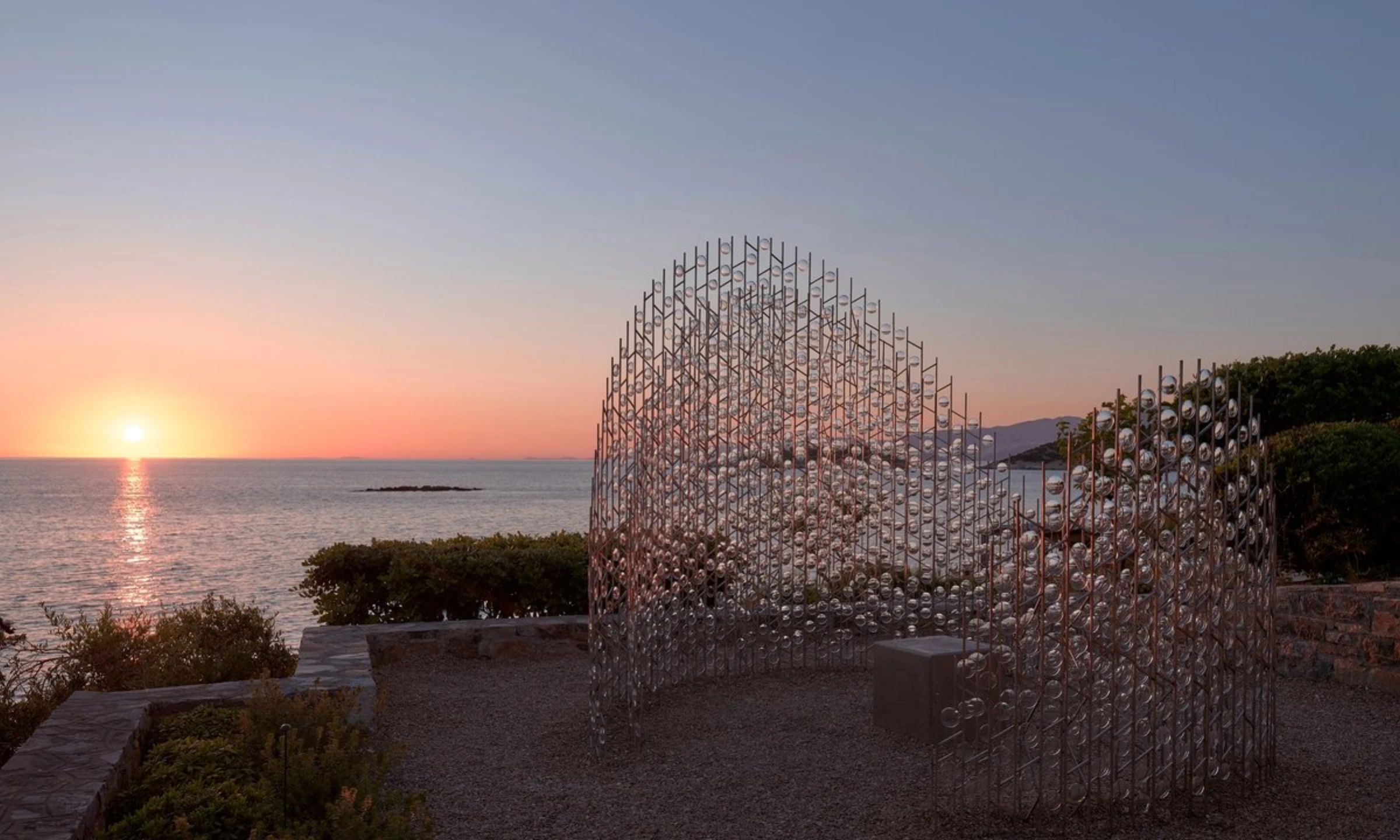 Chronotopia by Caitlind R.C. Brown and Wayne Garrett, made from eyeglass lenses, installed outdoors at Minos Palace Resort in Crete