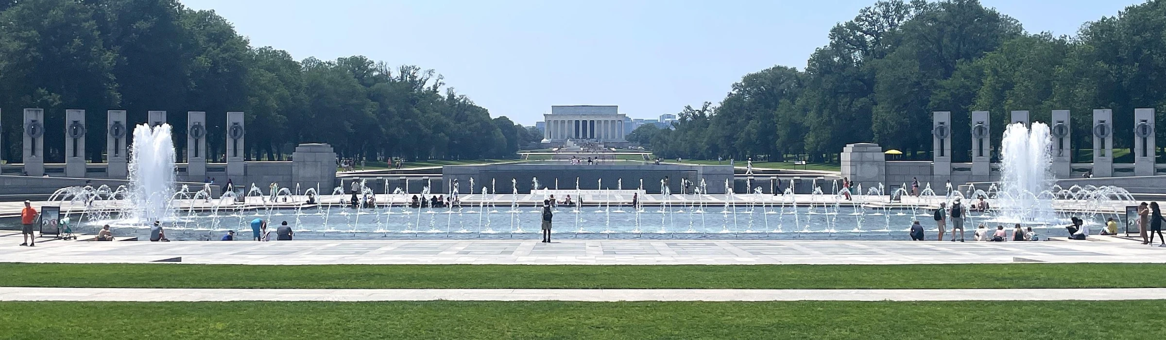 Wide view of the National Mall in Washington, DC with the Capitol visible beyond the lawns