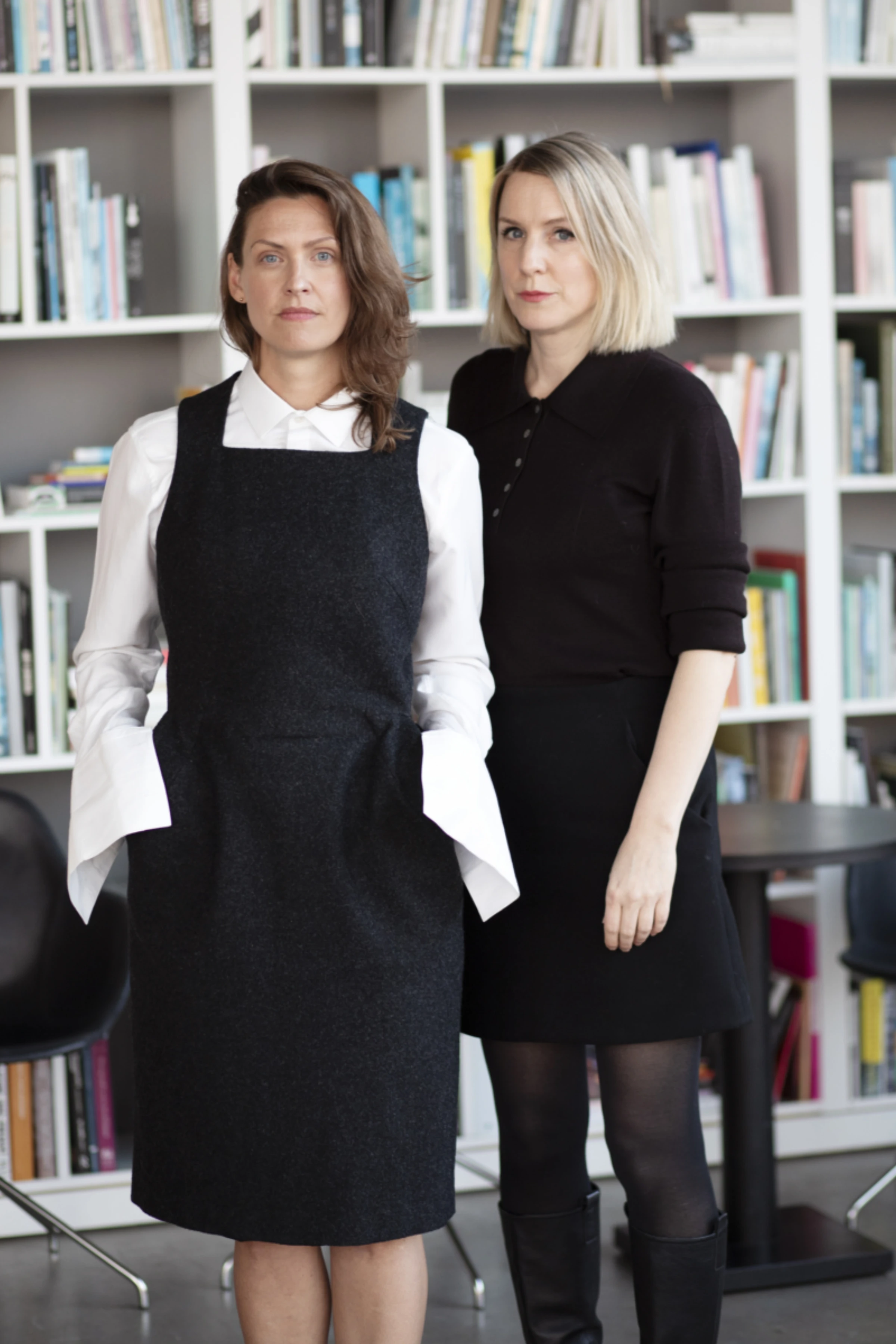 Visitors at Market Art Fair in Stockholm viewing contemporary artworks in a fair booth.