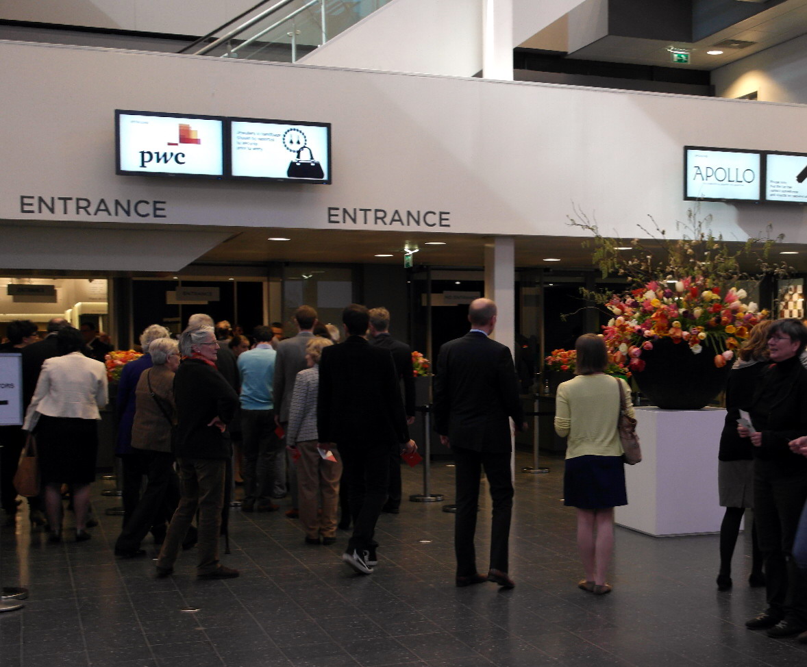 Visitors at an international art and antiques fair hall