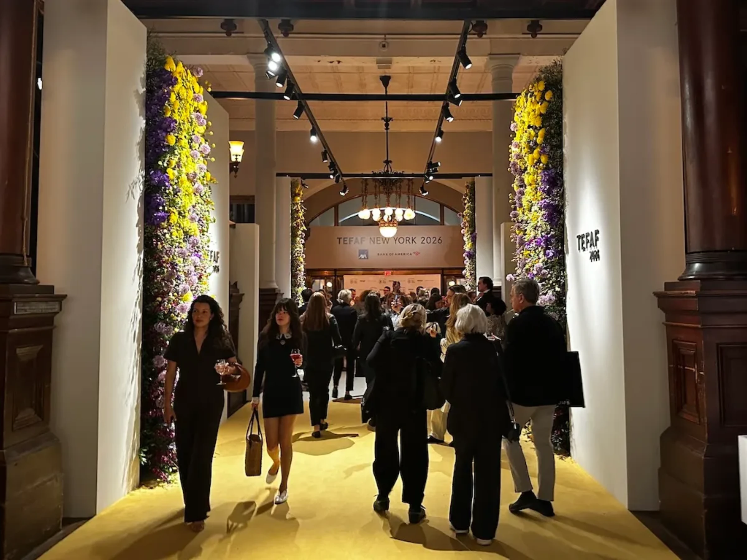 Crowded aisles and booths during TEFAF New York at the Park Avenue Armory